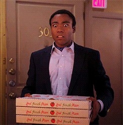 Character holding a stack of pizza boxes and looking shocked