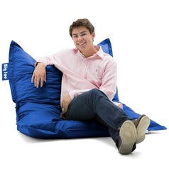 Model sitting on blue bean bag chair