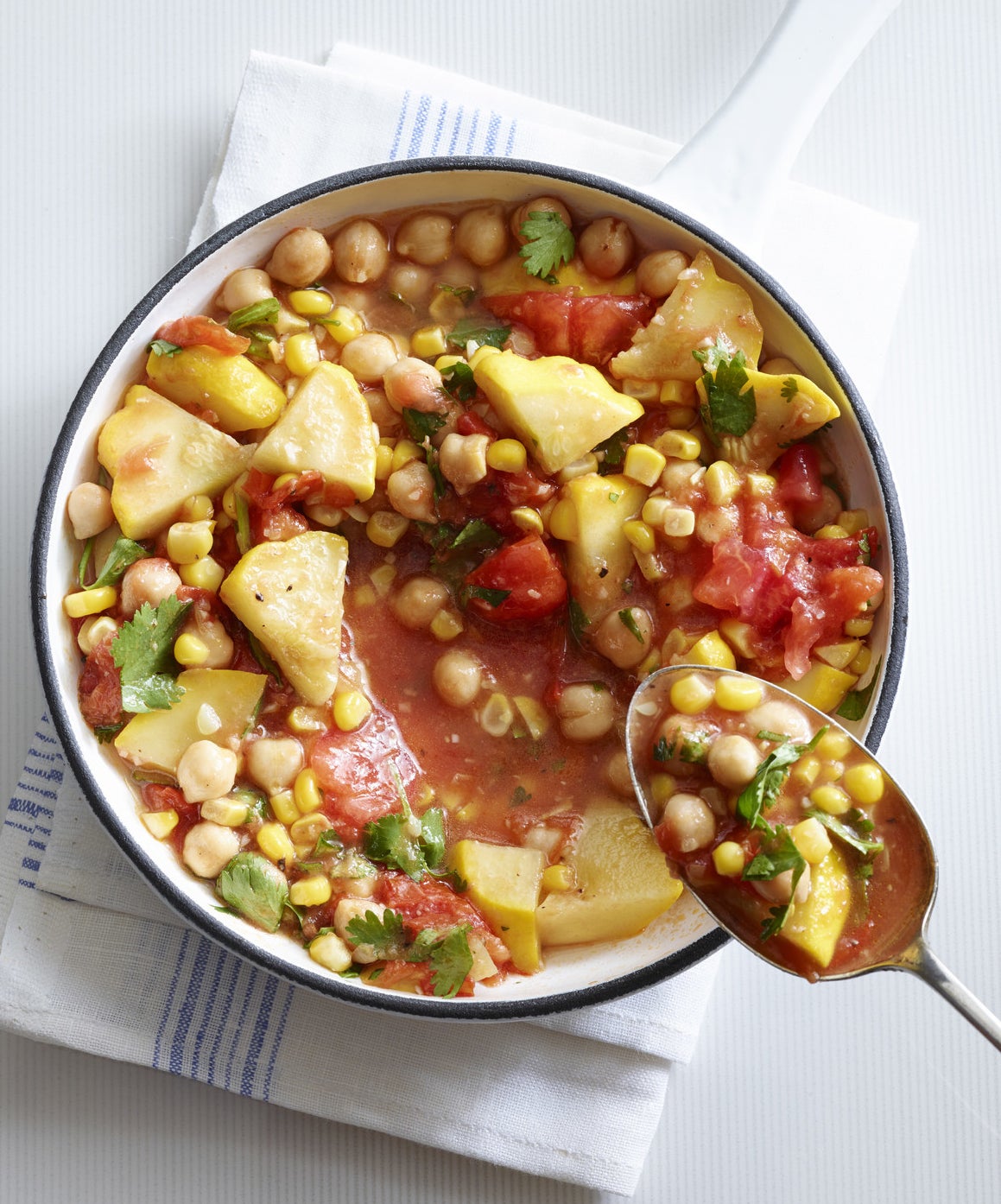A bowl of chickpea and vegetable soup.