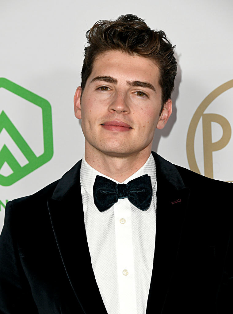 Gregg Sulking in a suit and bowtie at a red carpet