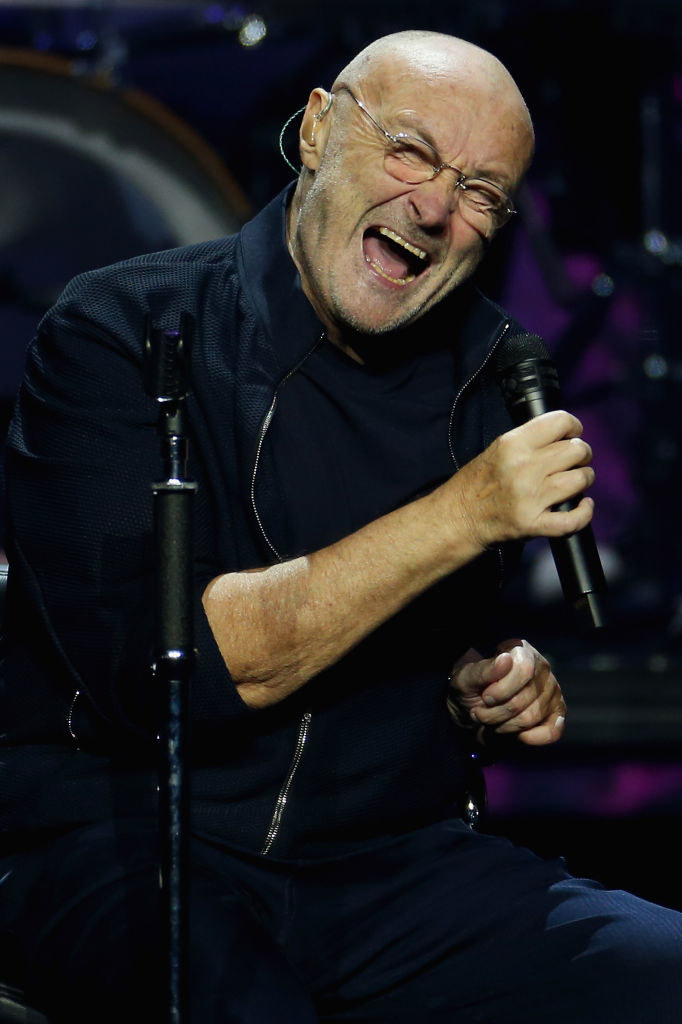 Phil Collins singing in concert in 2019