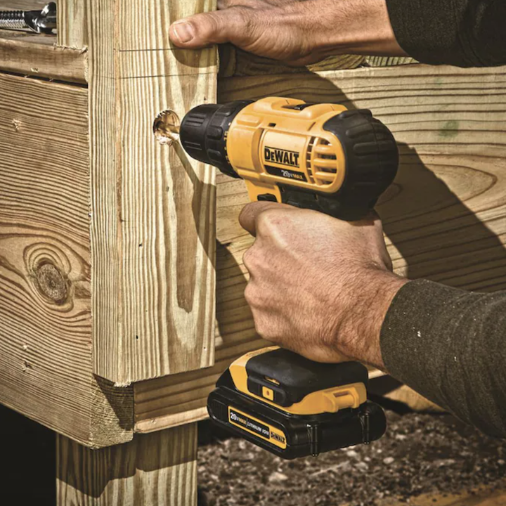 Model using DeWalt cordless drill