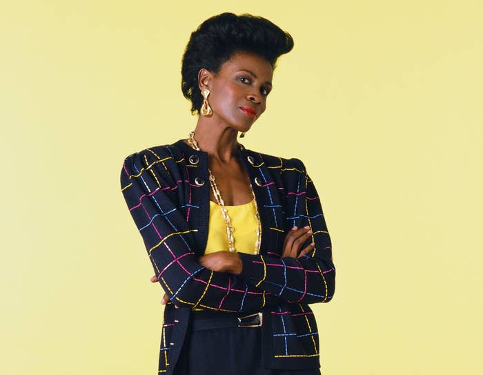 Janet stands with her arms crossed in a promo photo from Fresh Prince