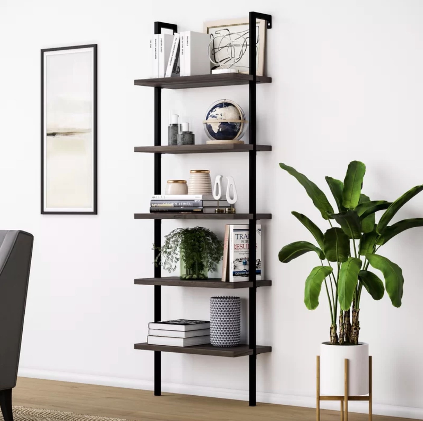 the steel bookcase next to a potted plant