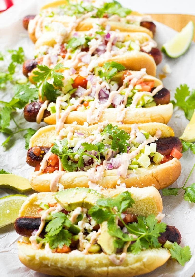 Mexican-style hot dogs with avocado, cilantro, and spicy mayo