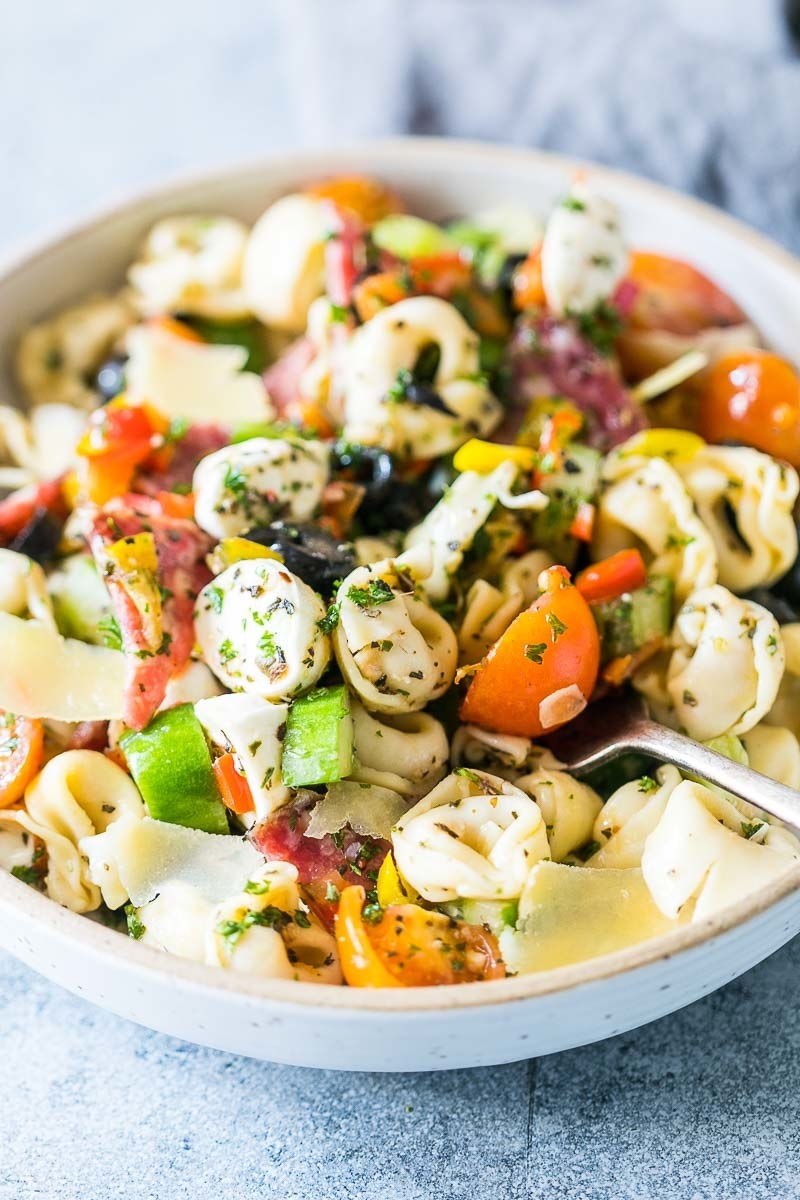 Tortellini salad with veggies, mozzarella, olives, and cheese