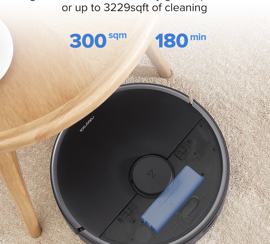 Roborock max robotic vacuum under a kitchen table