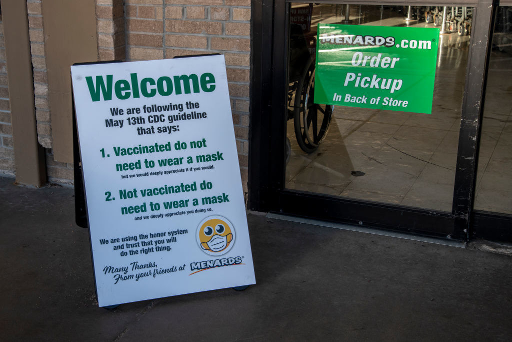 A sign outside a store says &quot;Welcome, we are following the May 13th CDC guidelines that say 1) Vaccinated to not need to wear a mask and 2) Not vaccinated to need to wear a mask&quot;