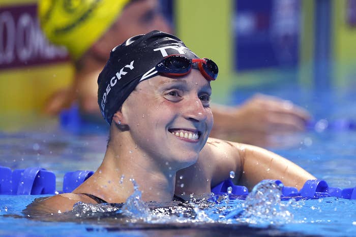 Katie Ledecky smiling while in the pool