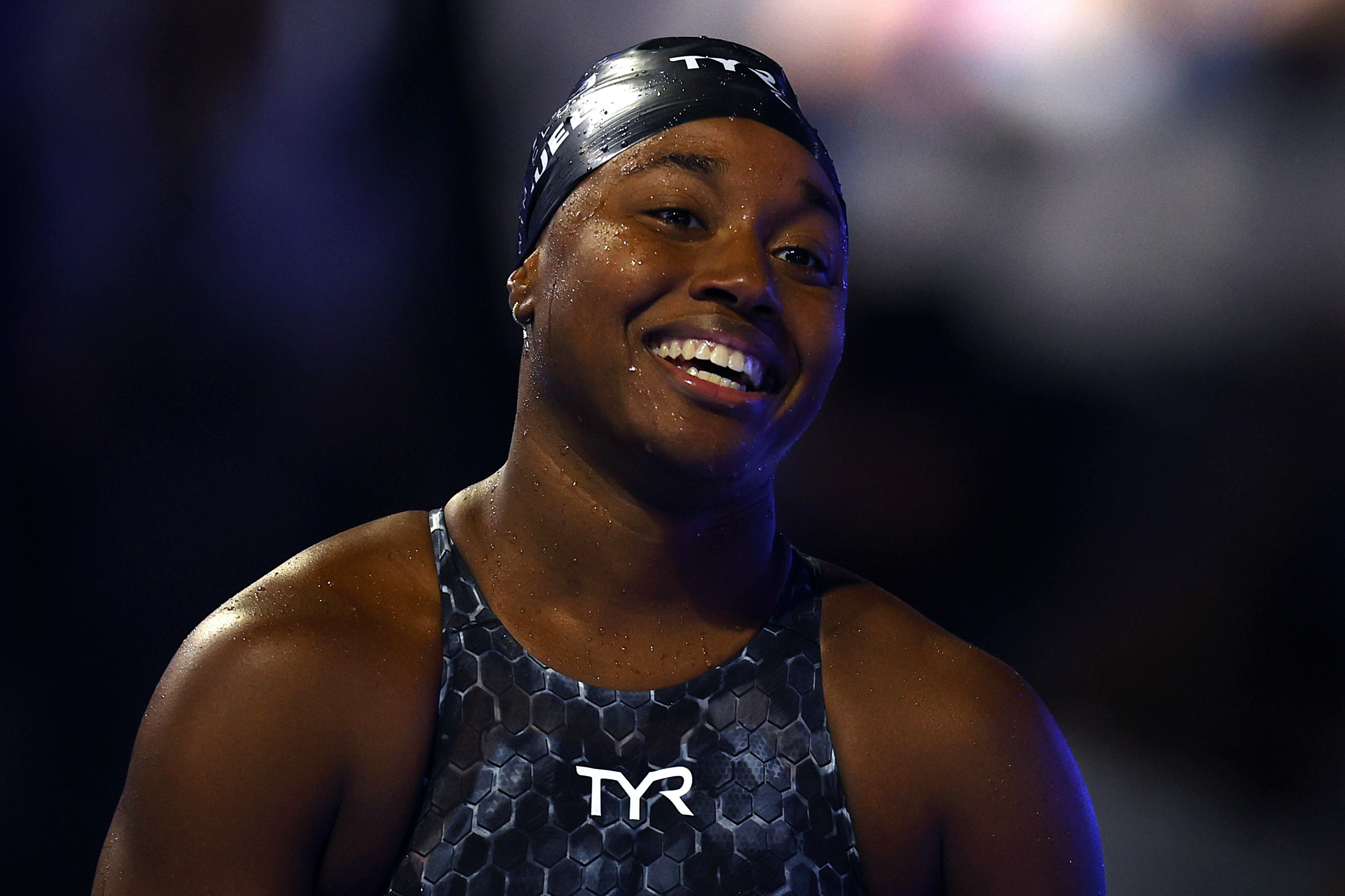 Simone Manuel smiles in her swim gear