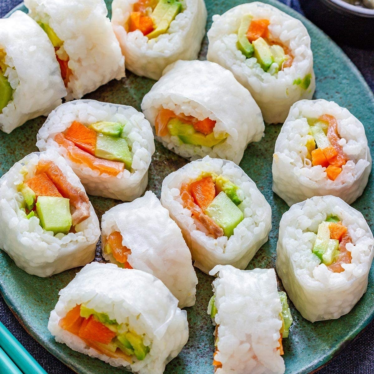 Kimbap with sticky rice and fresh vegetables rolled in rice paper.
