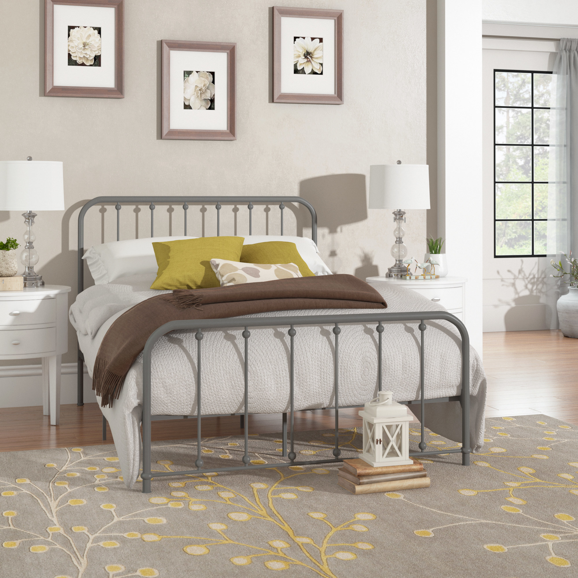 the grey bed with white and brown bedding
