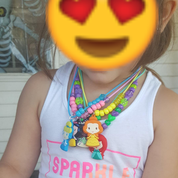 Reviewer's photo showing their child wearing the necklaces they made
