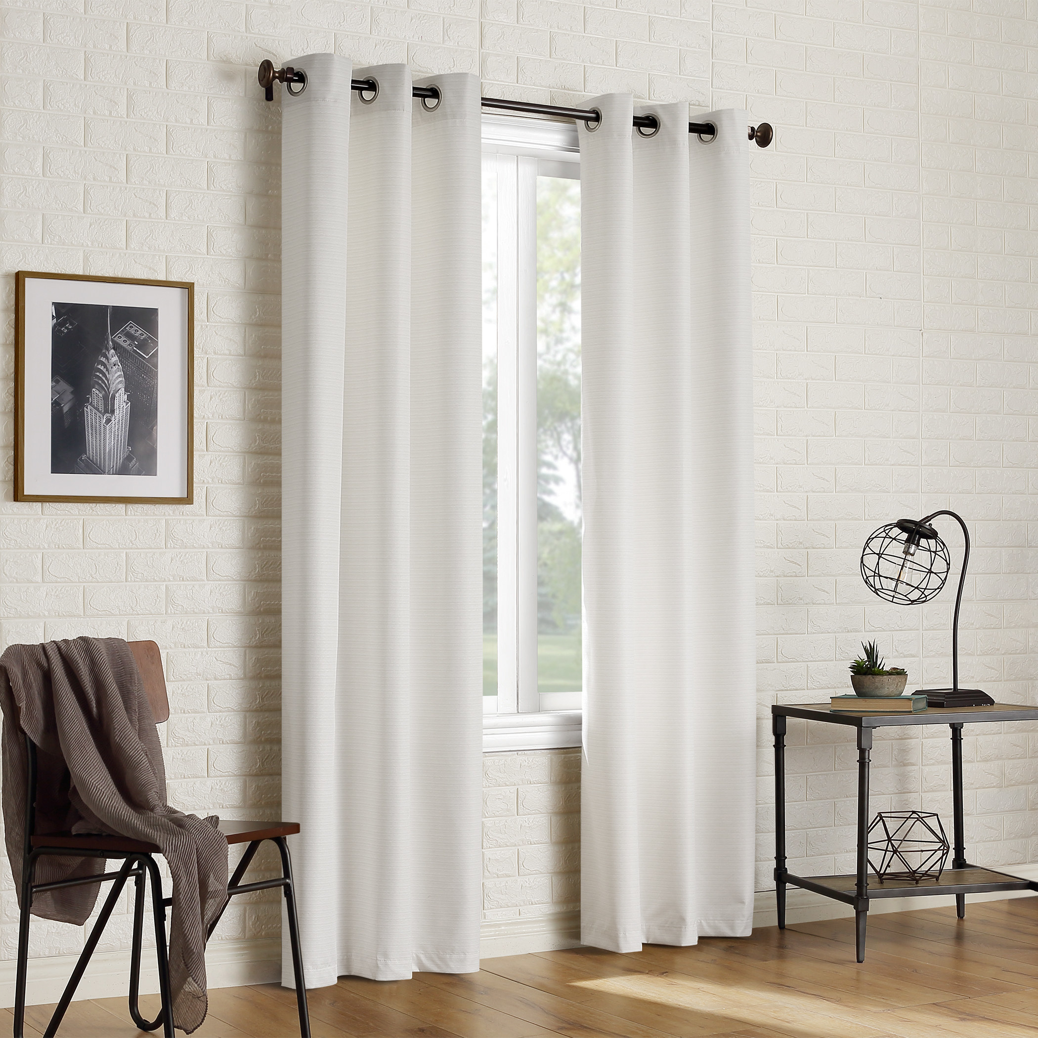 the white curtains in a decorated living space