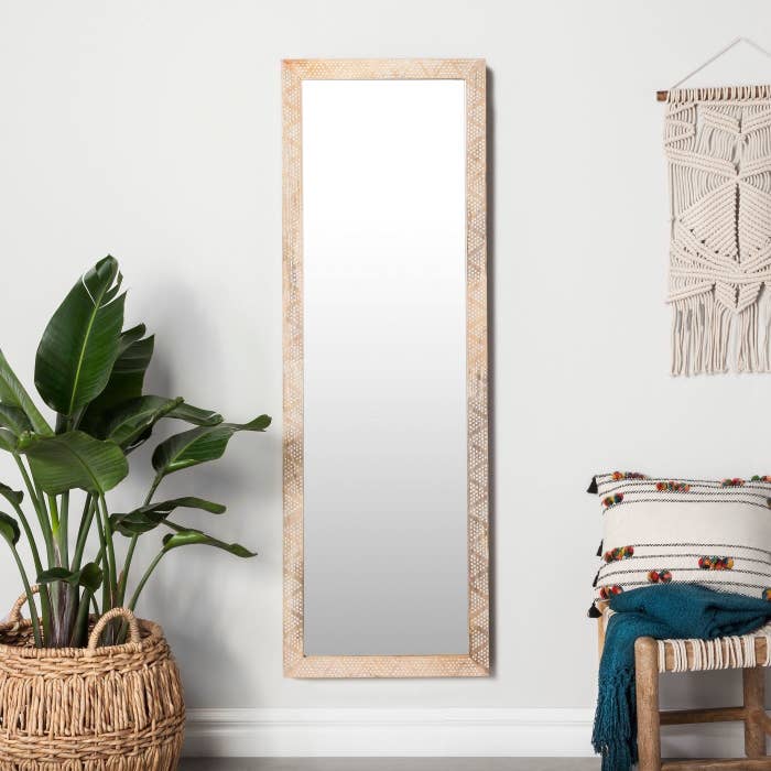 The natural wood floor mirror