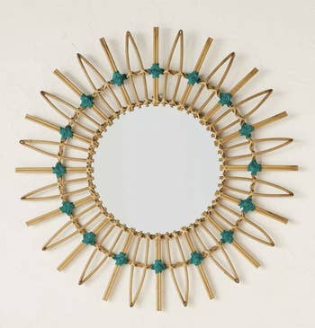a close up of the mirror with turquoise stitching