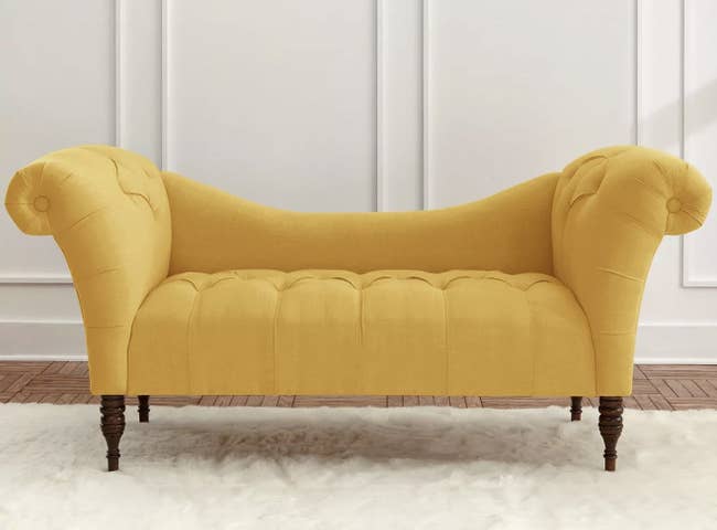 a mustard tuft chaise sofa