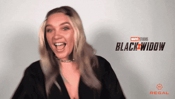Florence Pugh waving her hands excitedly