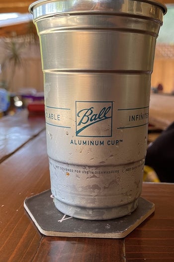 a reviewer photo of one of the silver aluminum cups
