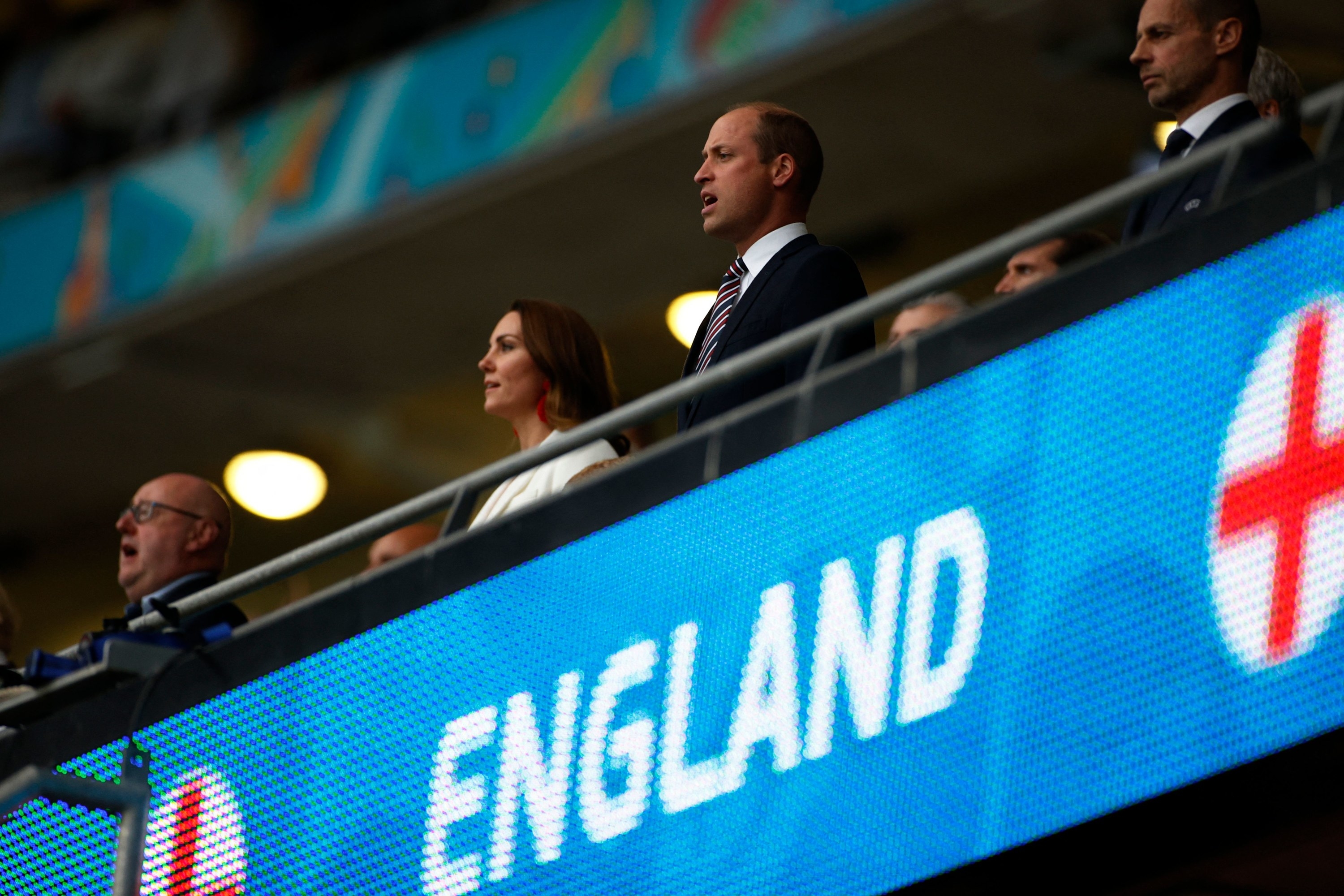 Kate and William in the stands below an &quot;England&quot; sign