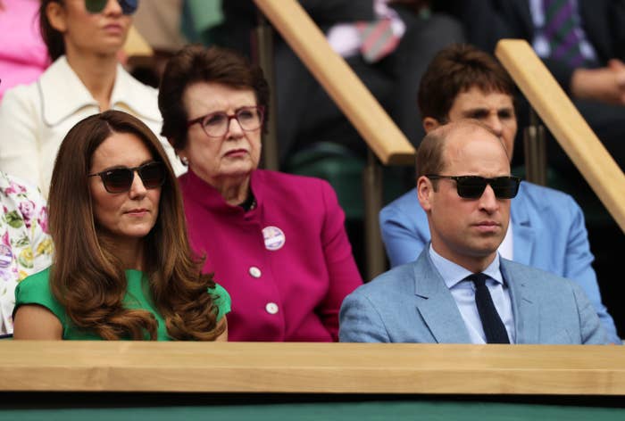 Kate and William wearing sunglasses in the stands