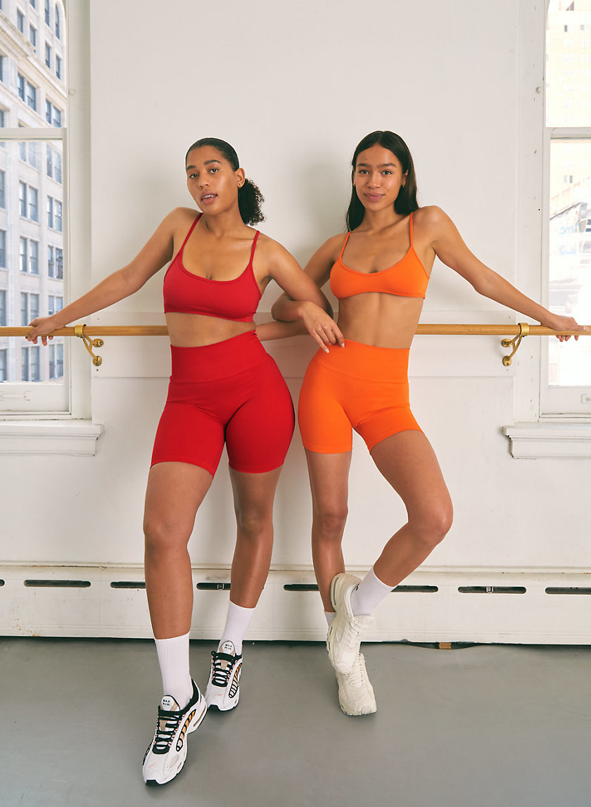 models wearing red and orange bra top