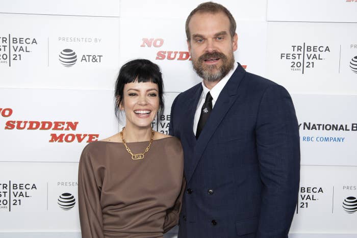 Lily Allen and David Harbour smiling and standing close together on the red carpet
