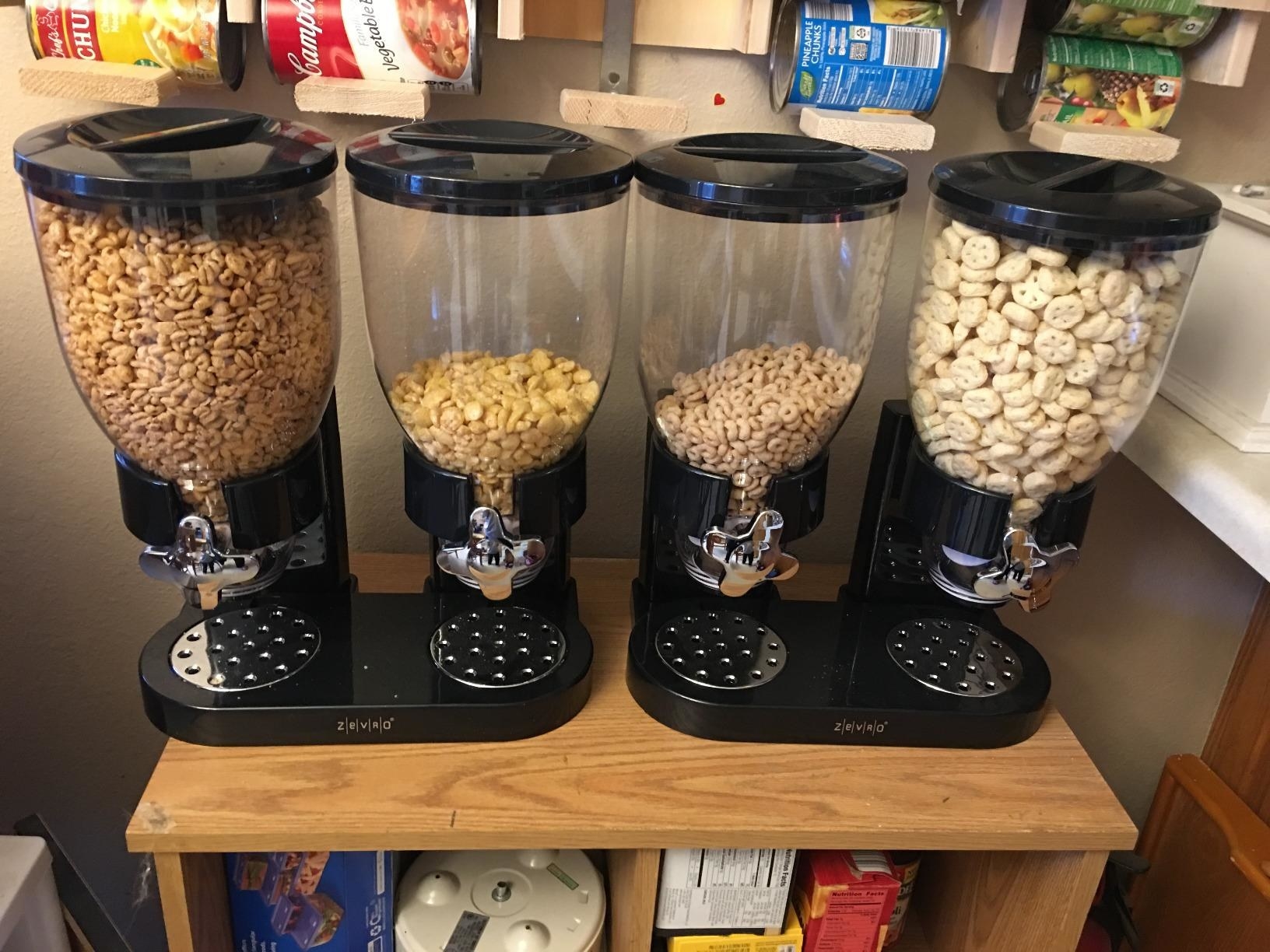 Two black dispensers in a pantry