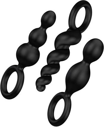 Three black anal plugs with different textures