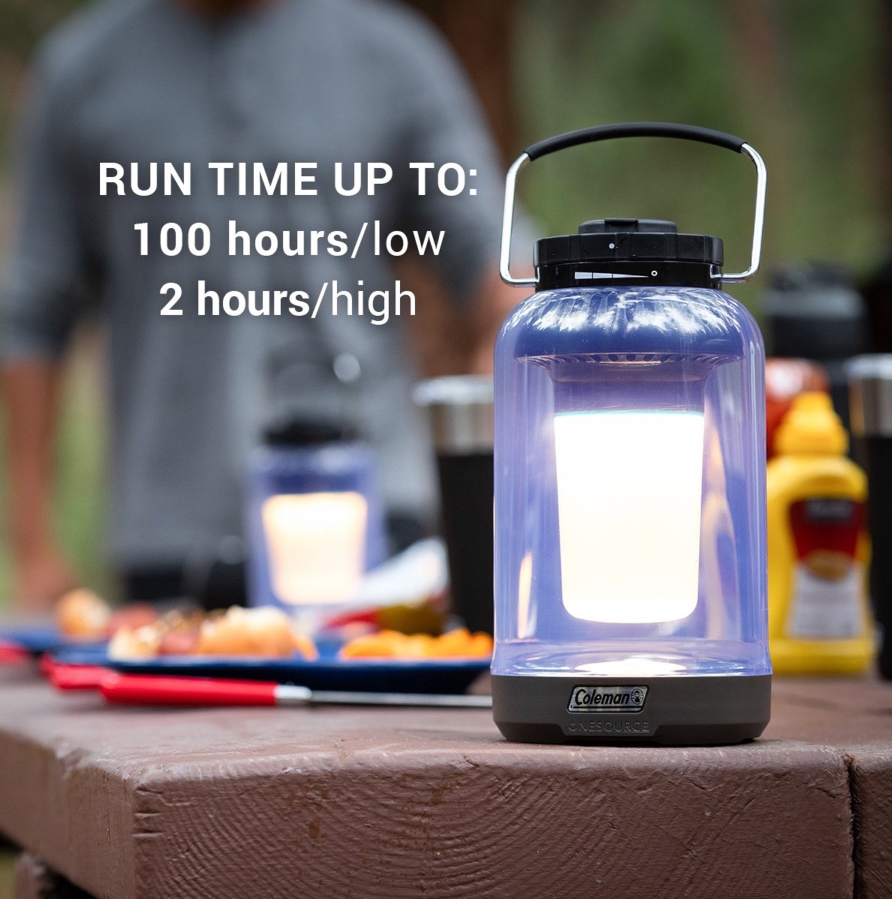 the glowing lantern on a picnic table