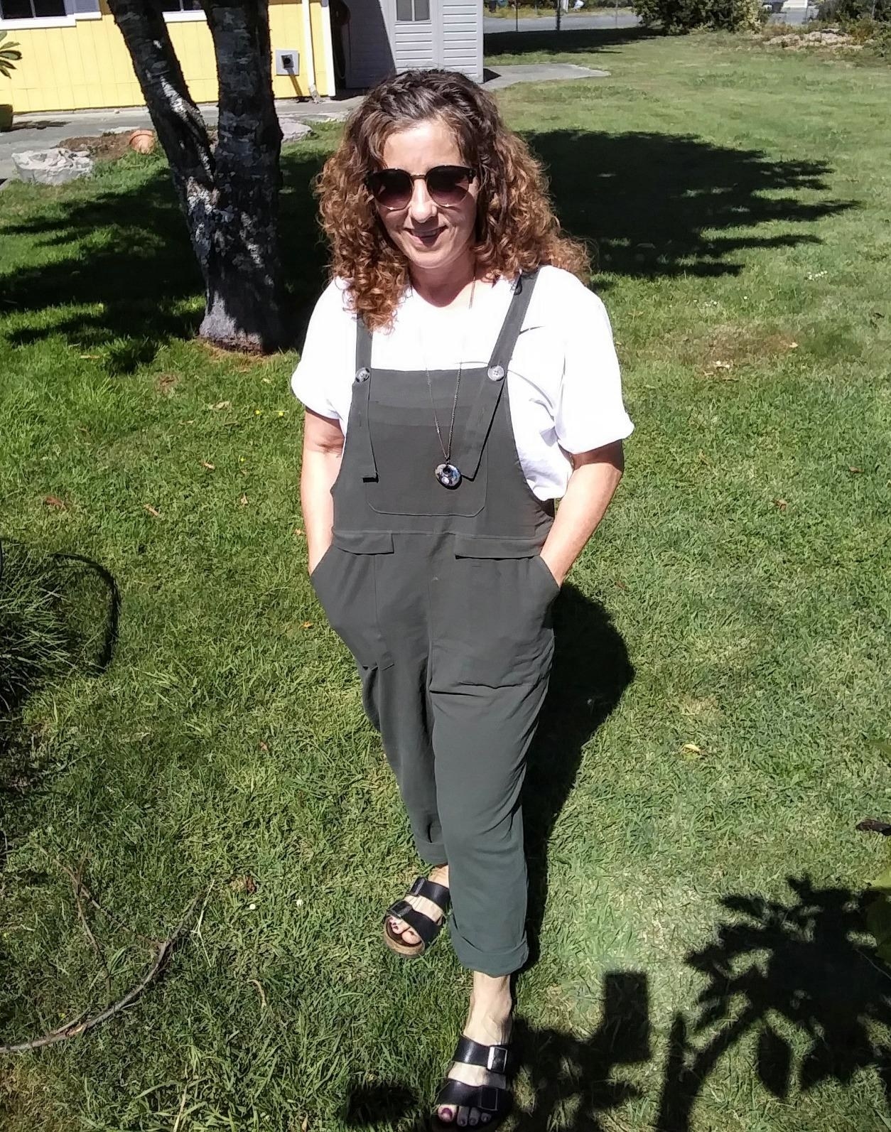 image of reviewer wearing the baggy overalls in army green size small