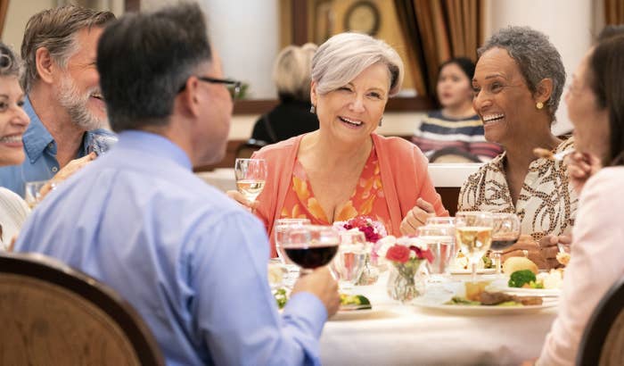 Group of baby boomers dining out at an upscale restaurant