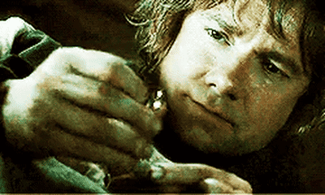 Bilbo Baggins looking at the ring.