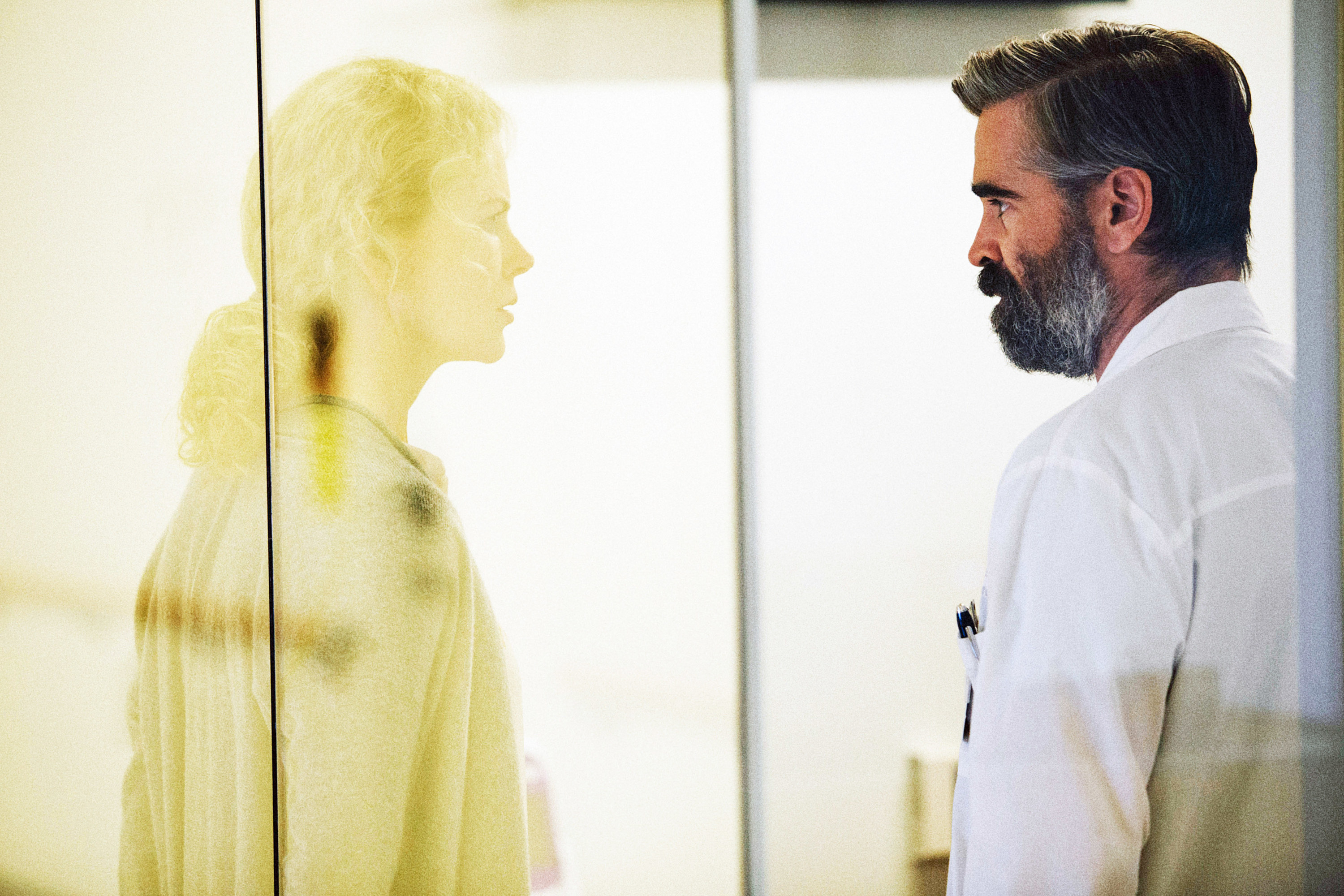 Colin Farrell looking at Nicole Kidman through glass