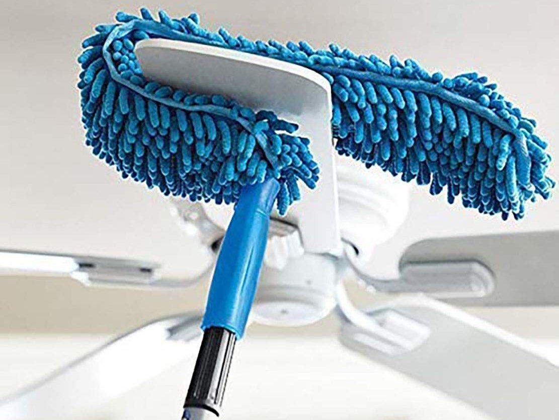 The microfibre duster being used to clean a fan.
