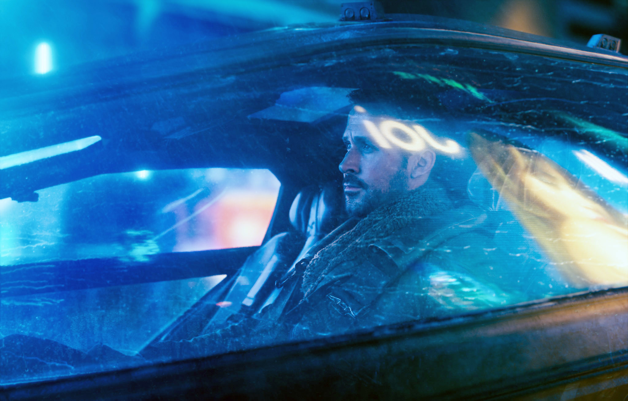 Ryan Gosling&#x27;s character in a futuristic car