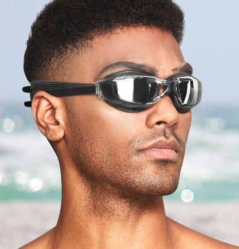 a person wearing the goggles on a beach