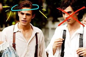 salvatore brothers, stefan has a halo drawn on and damon with x over his face