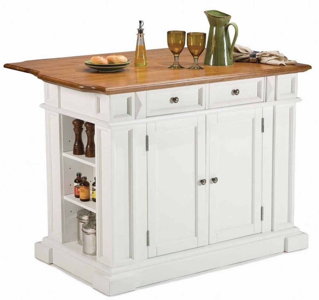 a freestanding island in white wood with a natural wooden top