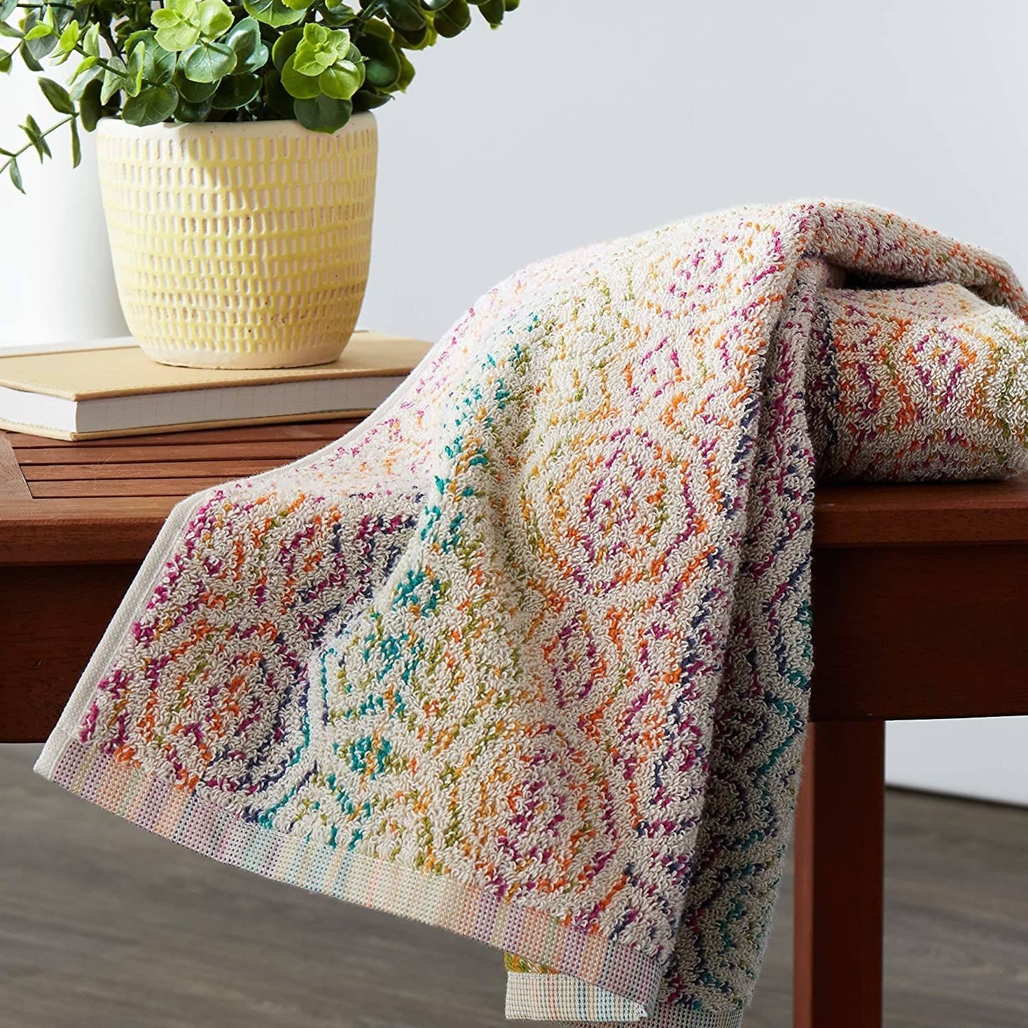 The colorful hand towel laid on a table