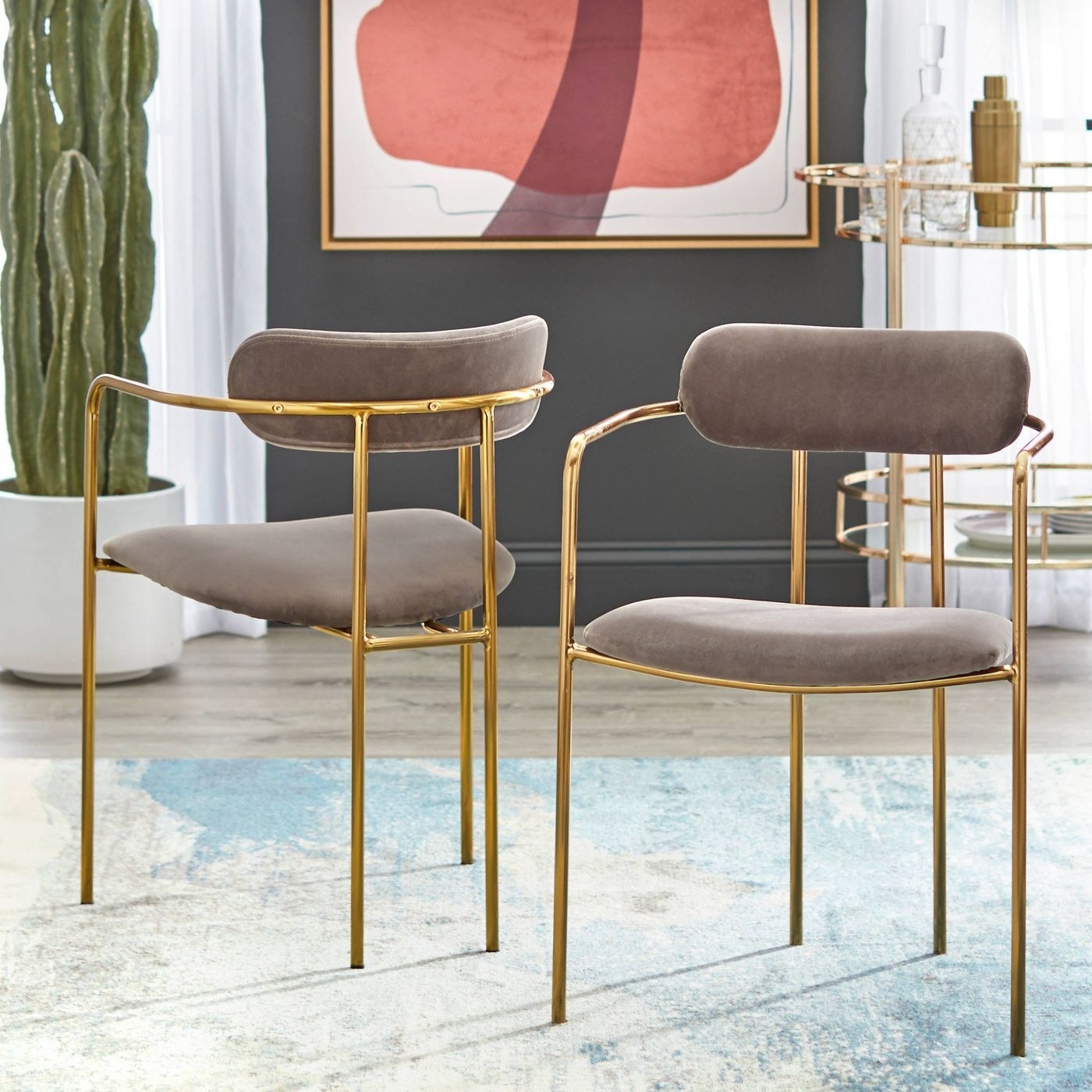 dining chairs with suede cushions and gold minimal legs and back rest