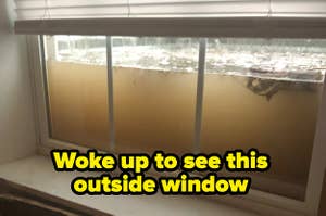 Water rises outside a window, threatening to break it