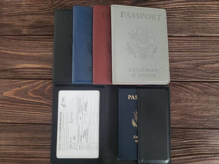 black, blue, red, and white passport cases