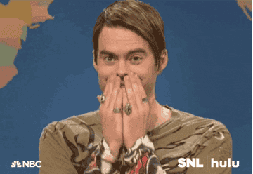 Stefon from SNL holds his hands over his face