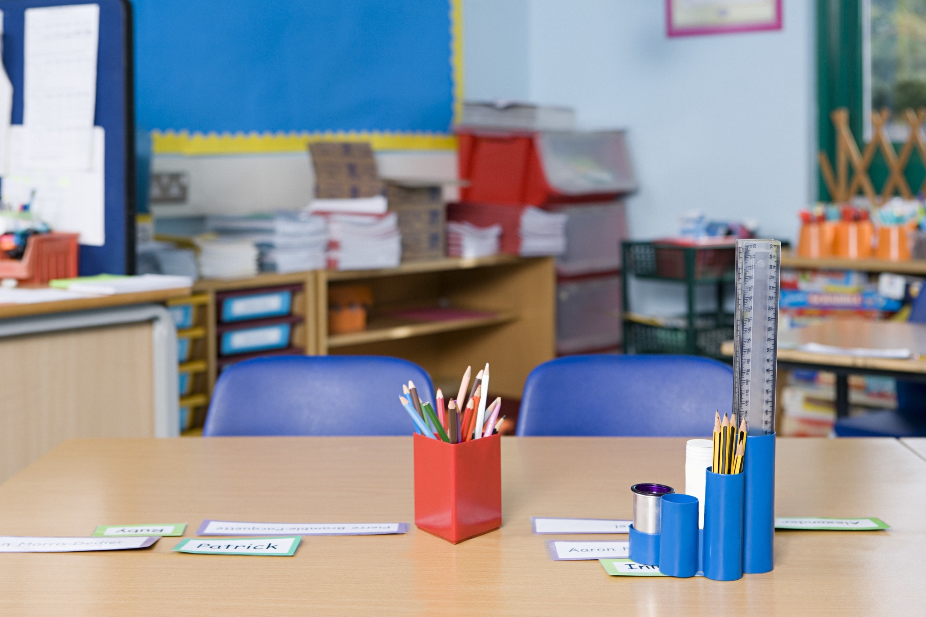 A school desk with supplies on it