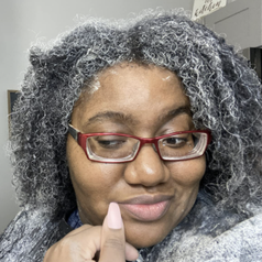 Reviewer with clay in her hair