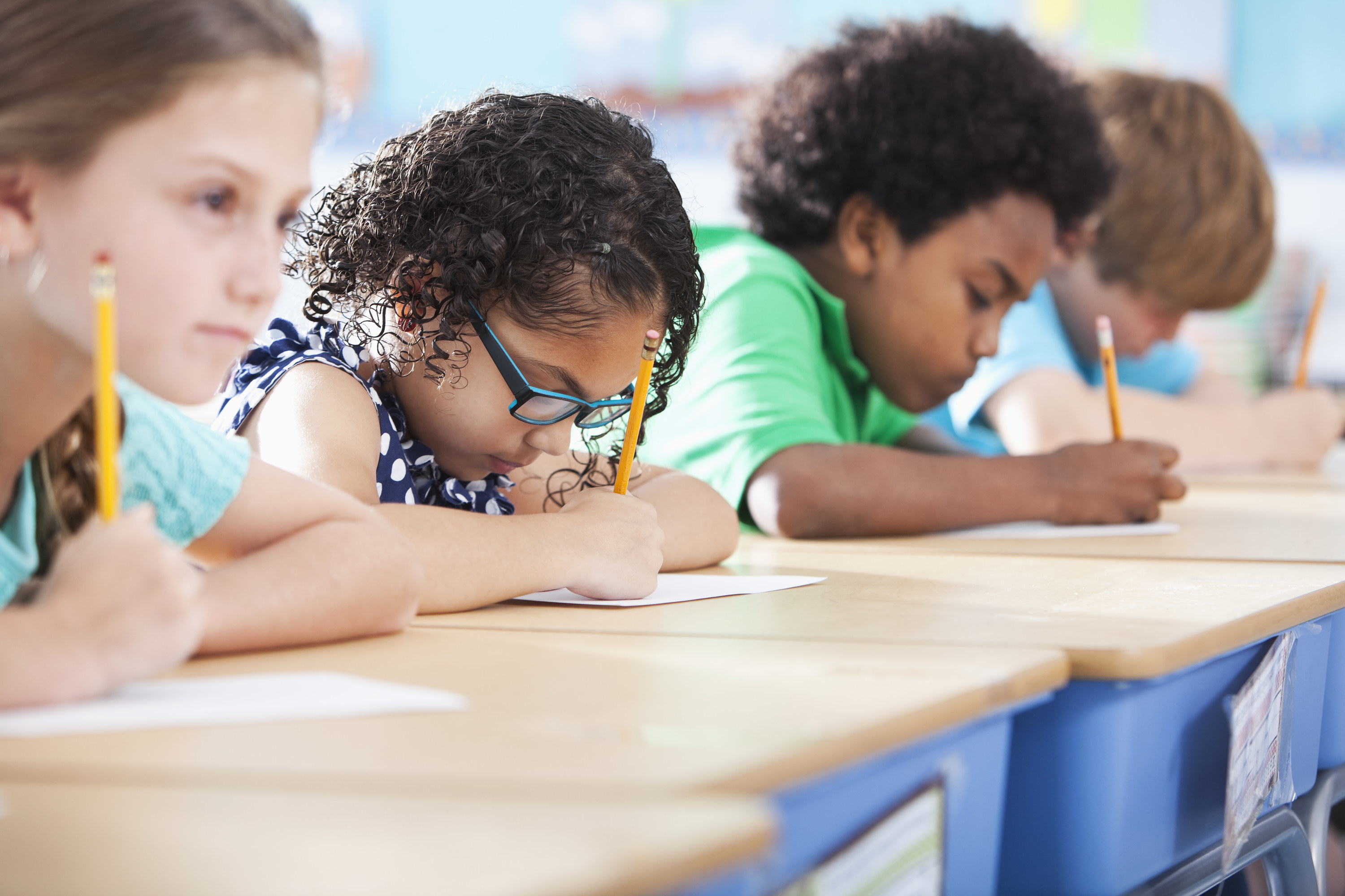 Young students working on an assignment at their desks