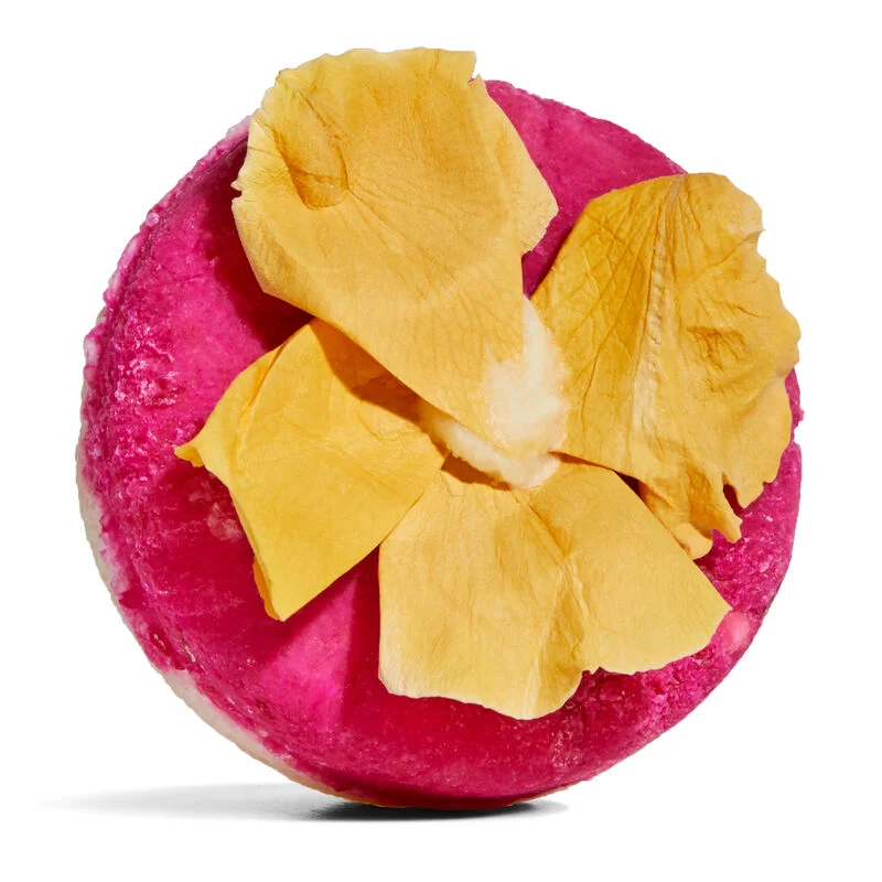 pink circular bar with yellow dried flower on it