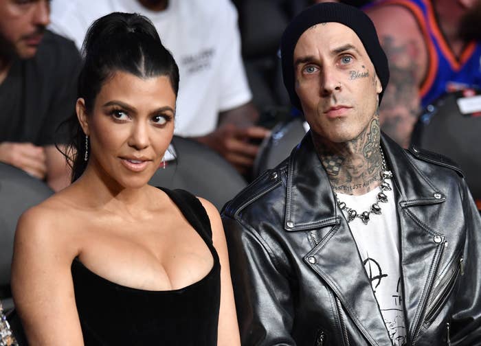 Kourtney and Travis sit next to each other while attending a boxing match