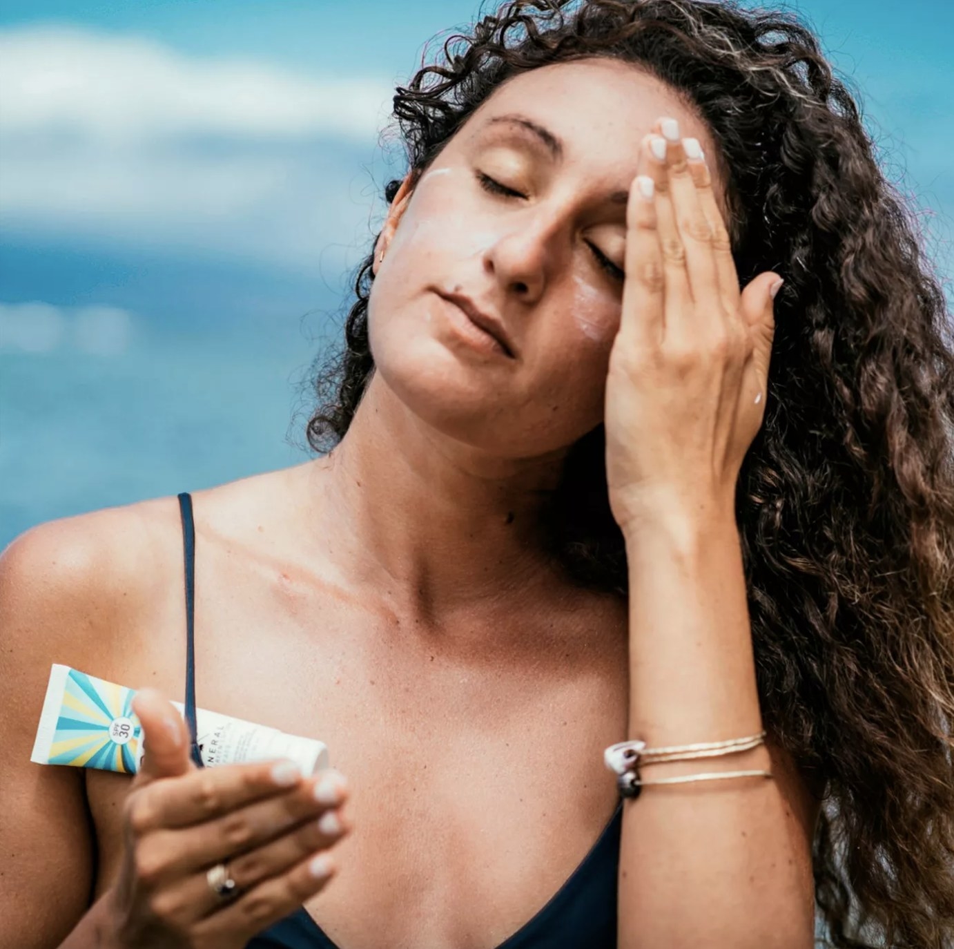 a person applying the sunscreen
